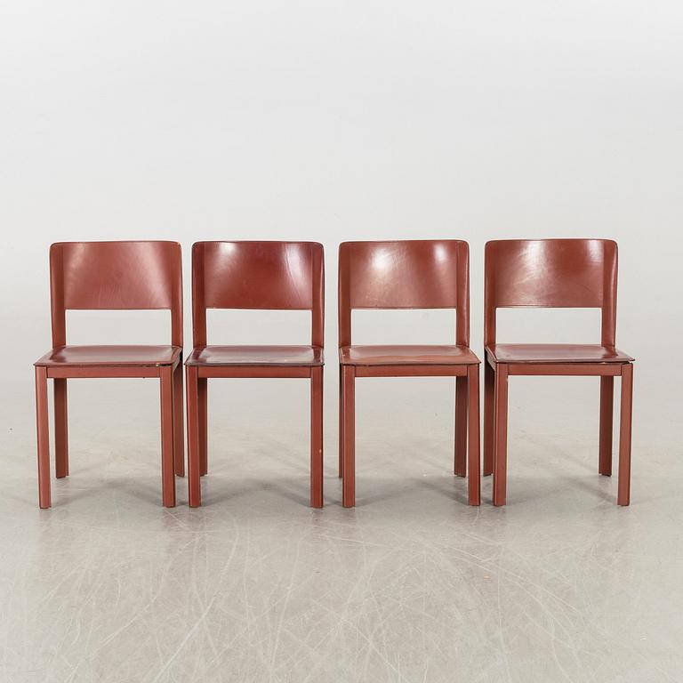 MATTEO GRASSI, a set of four leather chairs.