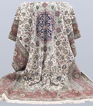 A part silk Tabriz carpet, 310 x 205 cm.