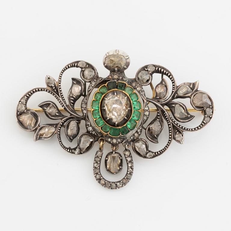 Gold and silver with rose cut diamond and emerald brooch.
