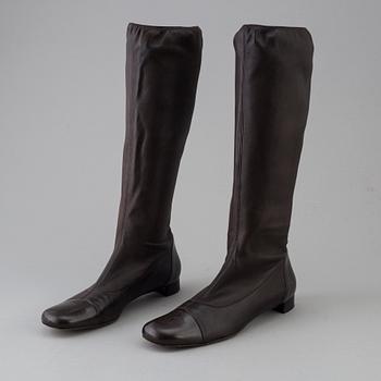 Brown leather boots by Chanel.