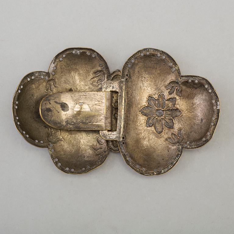 An 18th century brass buckle.