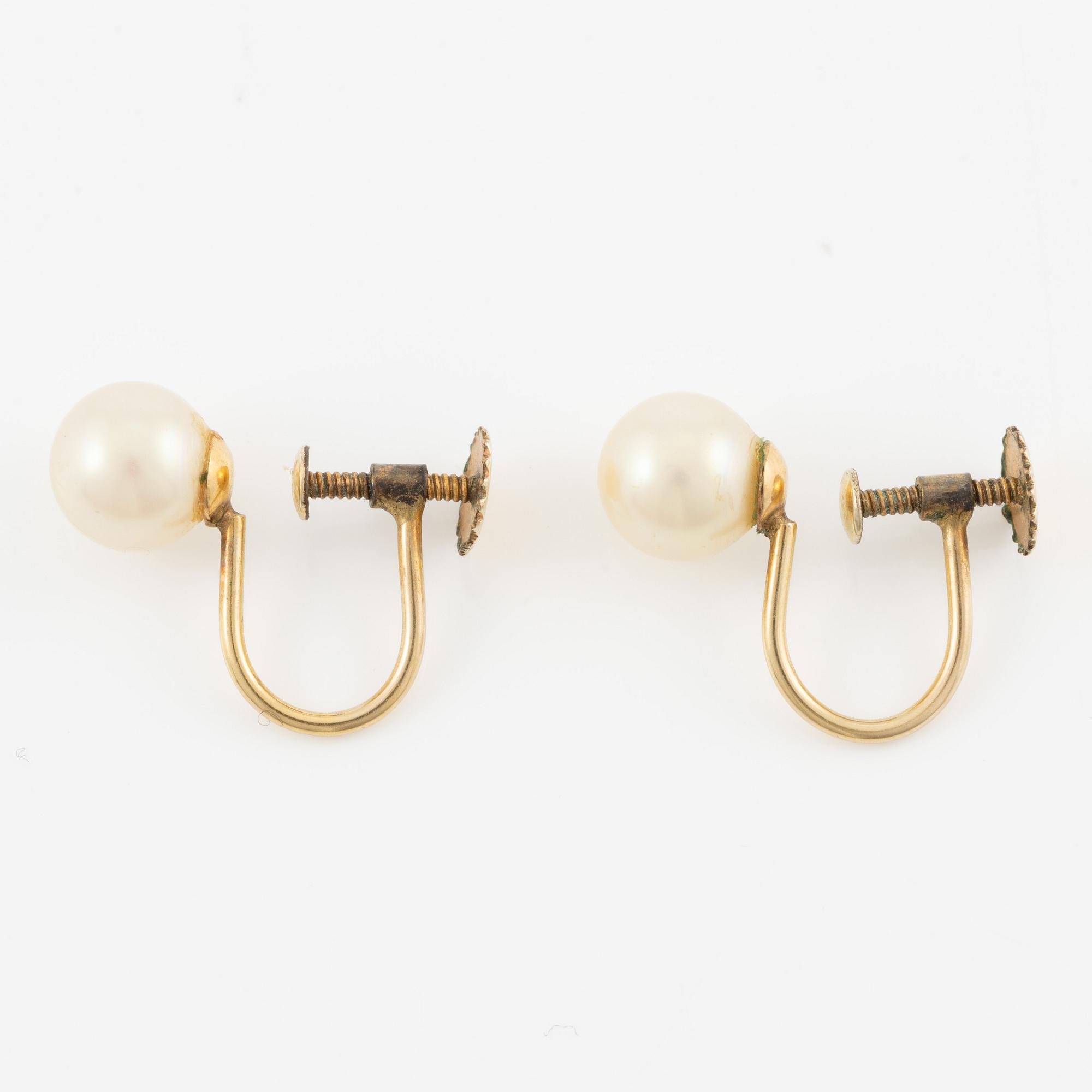 Pearl necklace with graduated cultured pearls, clasp in silver set with pastes, and a pair of pearl earrings,.
