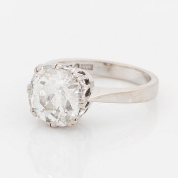 An 18K white gold ring set with a cushion formed old cut-diamond.