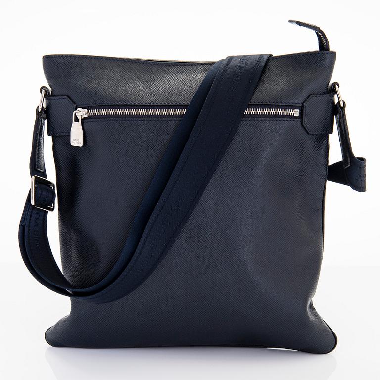 Louis Vuitton, a Navy Taiga 'Sasha' Messenger bag.