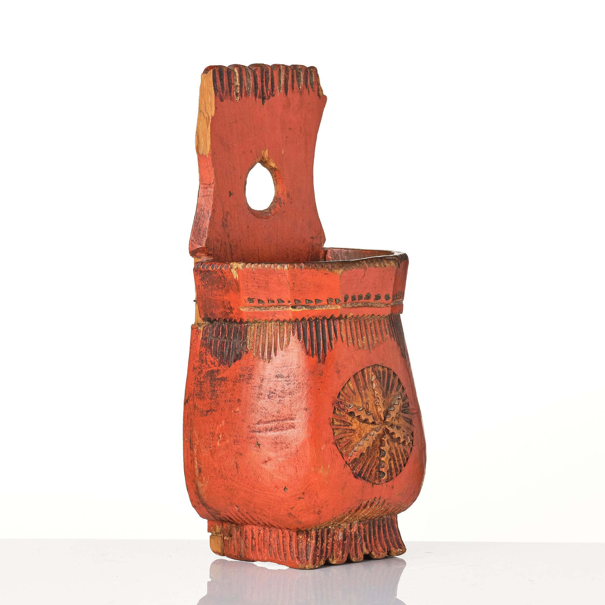 A Swedish folk art carved and painted spoon holder, 18th century.