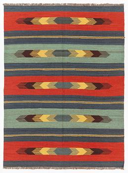 A kilim rug, c 242 x 181 cm.