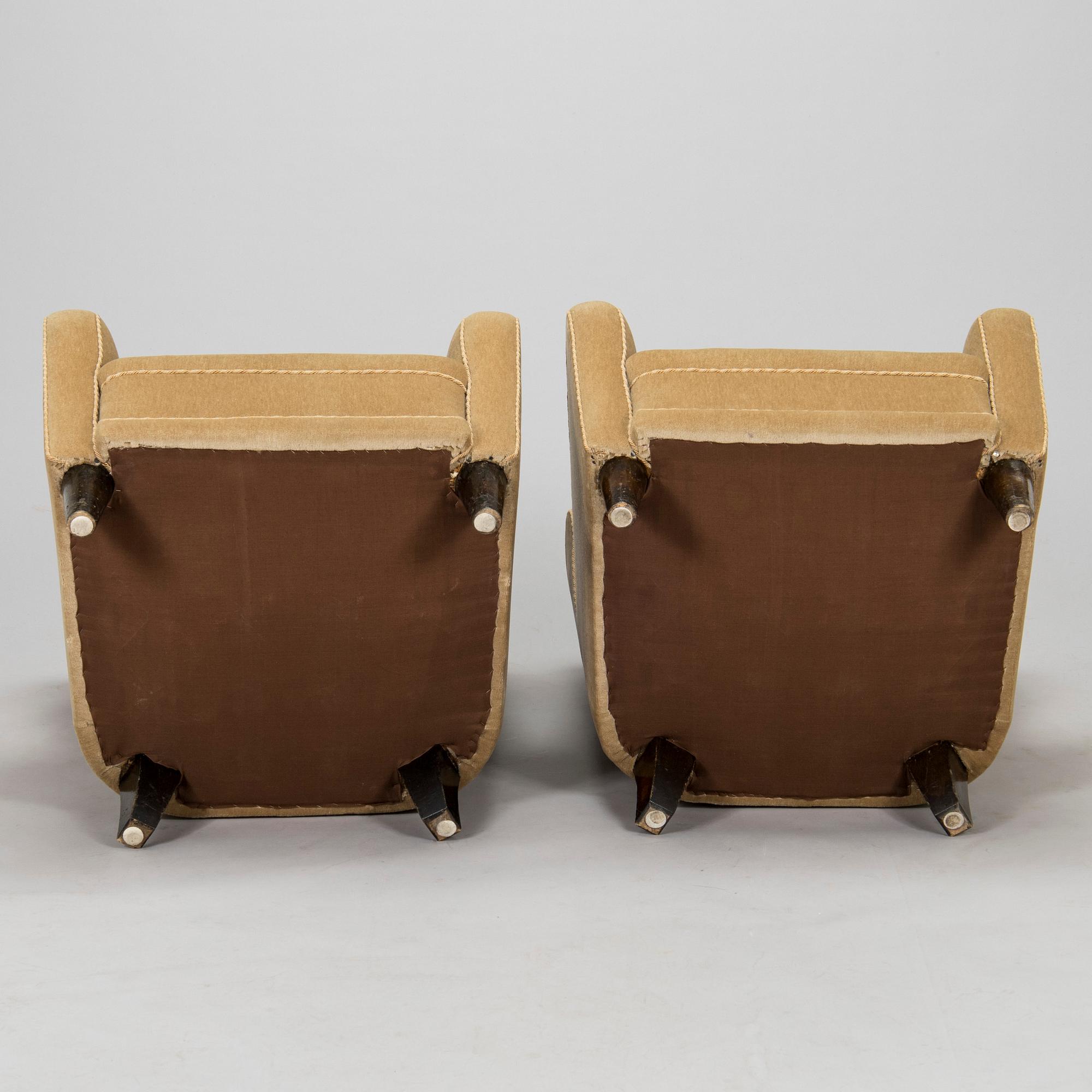 A pair of mid-20th century armchairs.