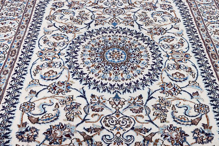 A Nain carpet, part silk, c. 291 x 201 cm.