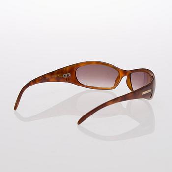 Two Pairs of Sunglasses, Prada and Chanel.