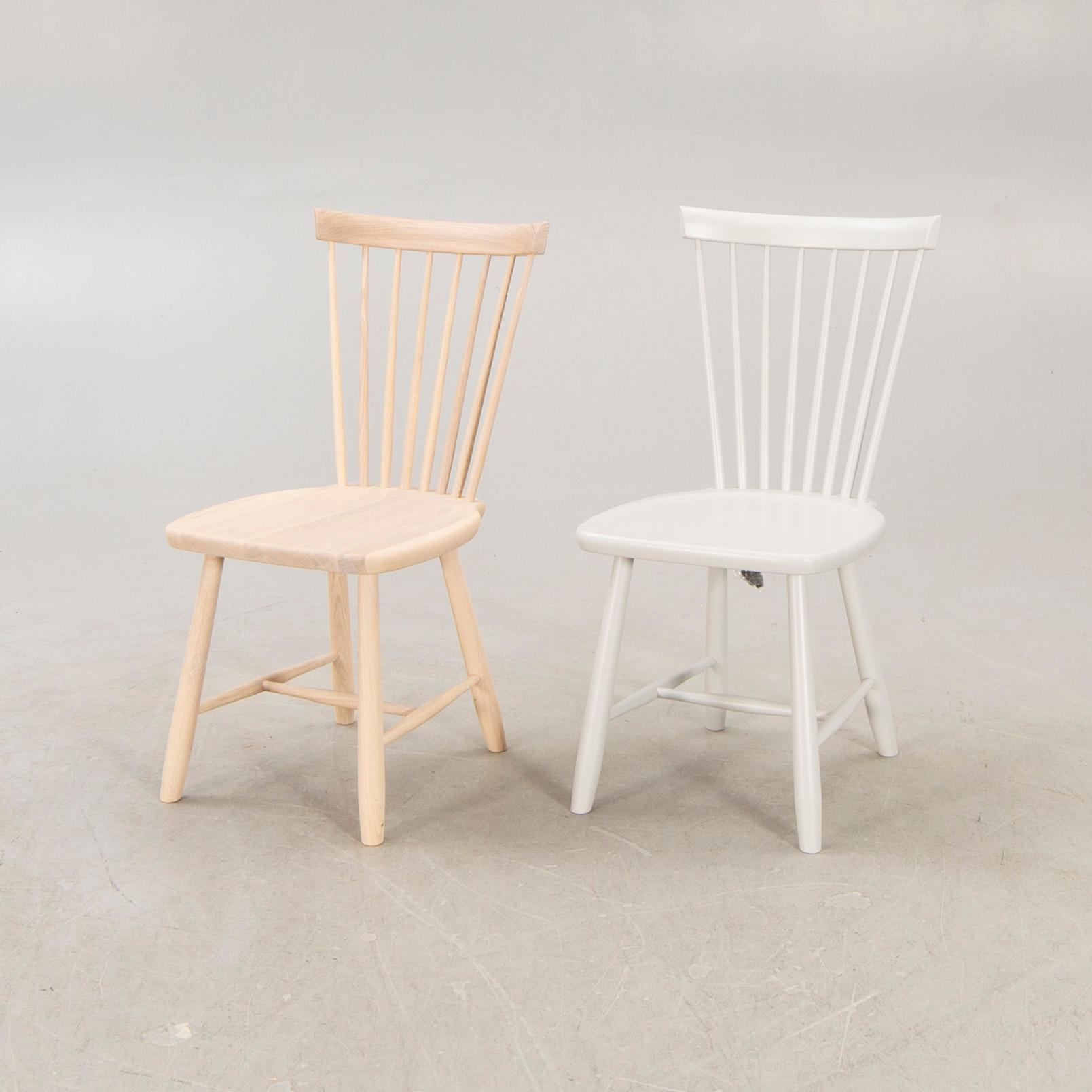 A set of two Carl Malmsten "Lilla Åland" chairs from Stolab, contemporary.
