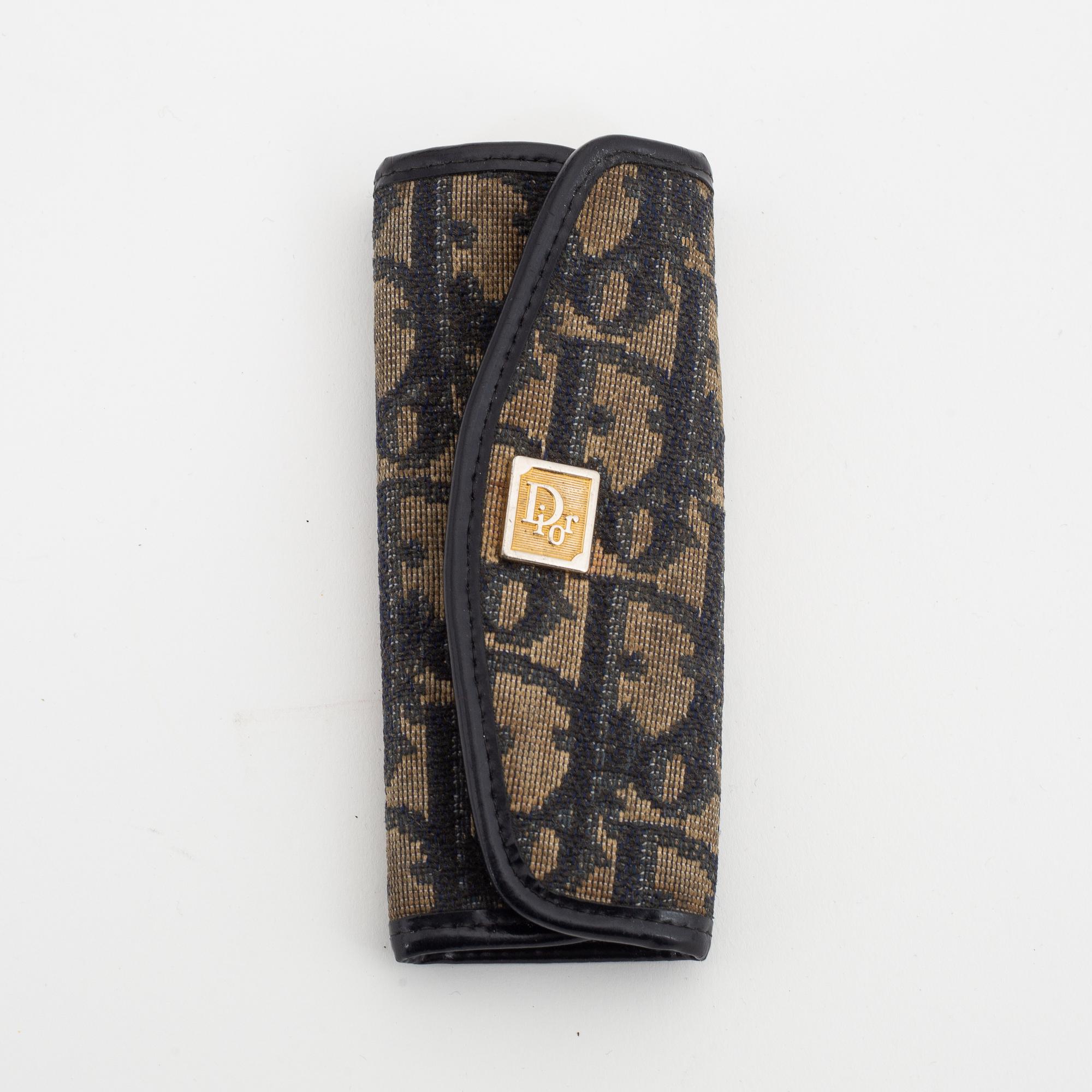 Christian Dior, a canvas handbag, toilet bag and key holder.