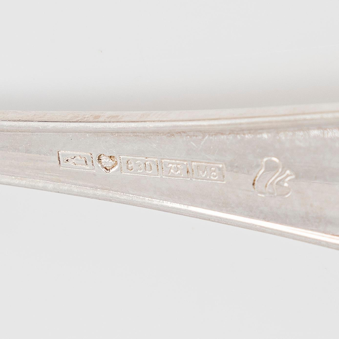 A 59-piece silver 'Chippendale' cutlery set, 20th century. Various Finnish manufacturers.