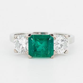 Emerald and brilliant-cut diamond three stone ring.