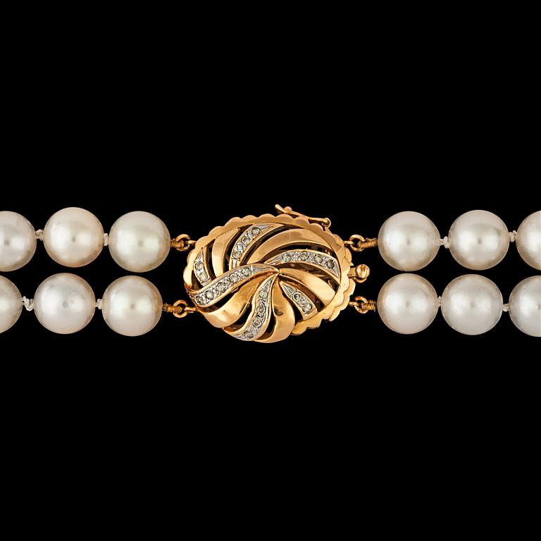 A two strand cultured pearl necklace, 8.2 mm, clasp set with brilliant cut diamonds, total carat weight circa 0.20ct.