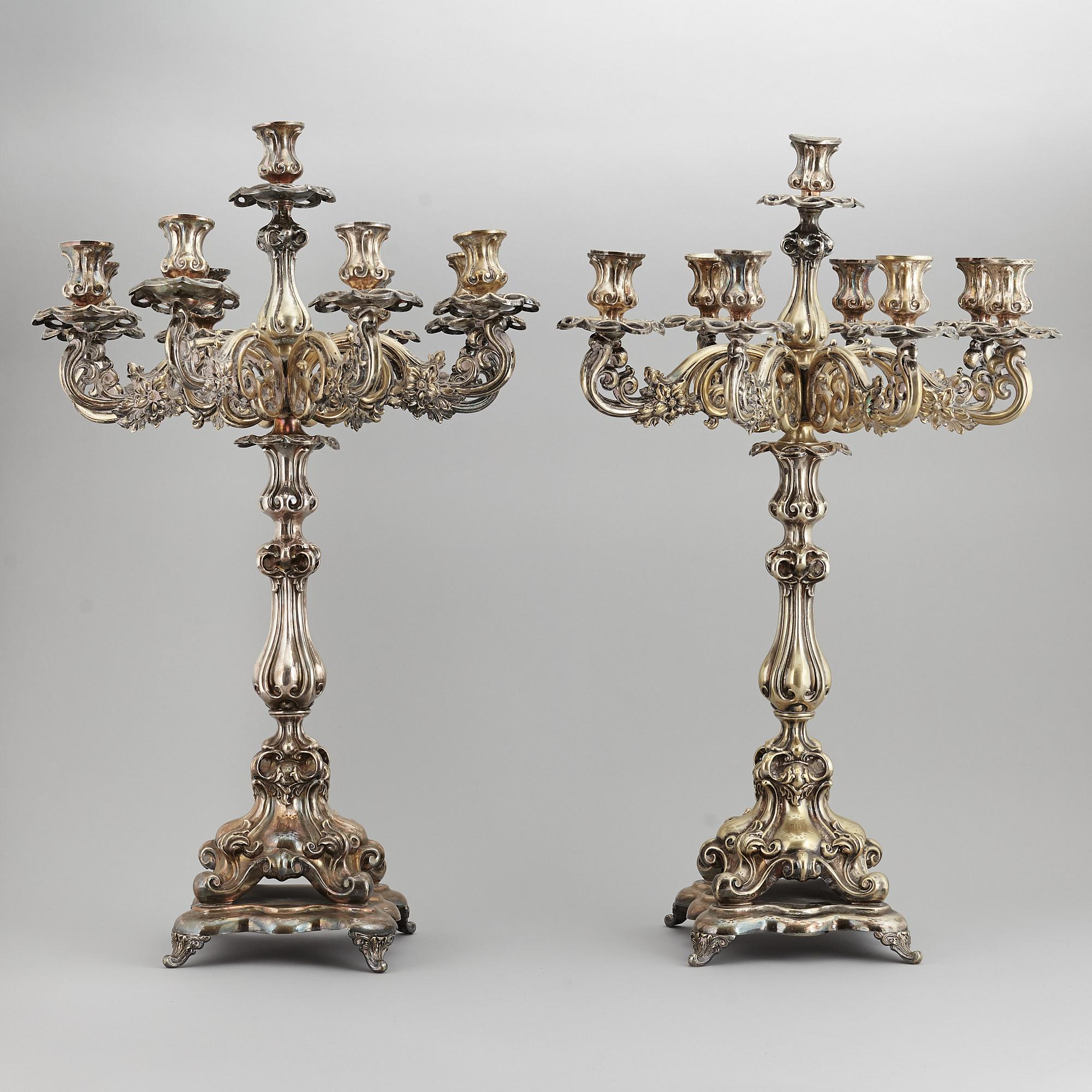 A pair of barocque style nine lights candelabra, silver plate, 20th Century.