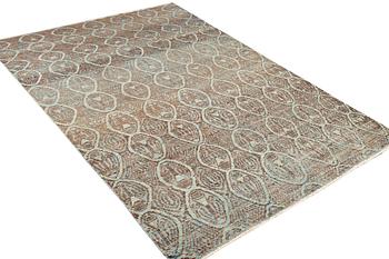 An oriental carpet with modern design, c. 308 x 202 cm.