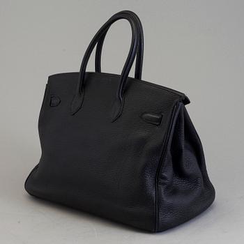 A dark blue togo "Birkin 35" bag by HermÈs from 2009.