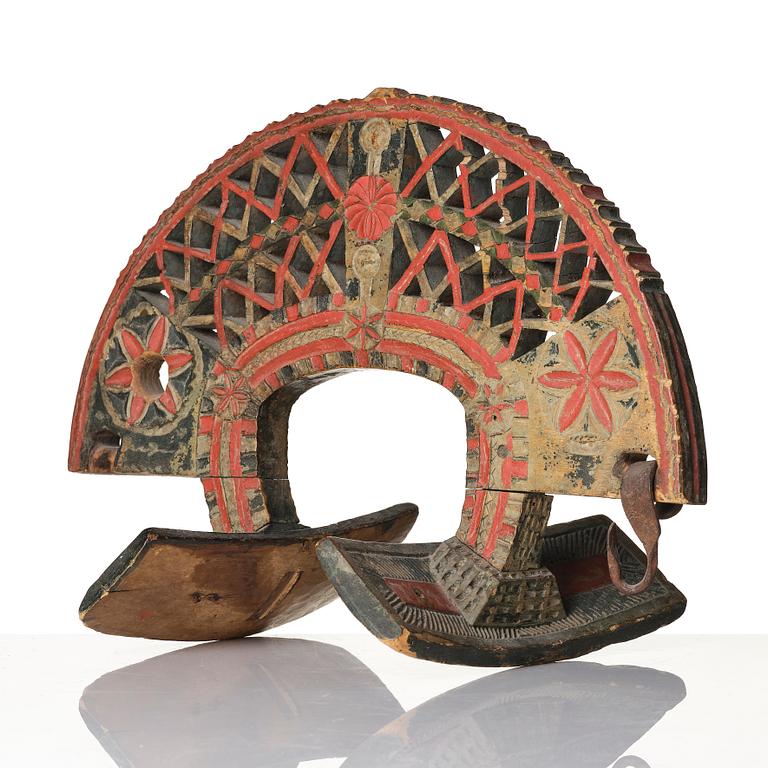 A Swedish folk art carved and polychrome-painted part horse harness, Uppland, dated 1774.
