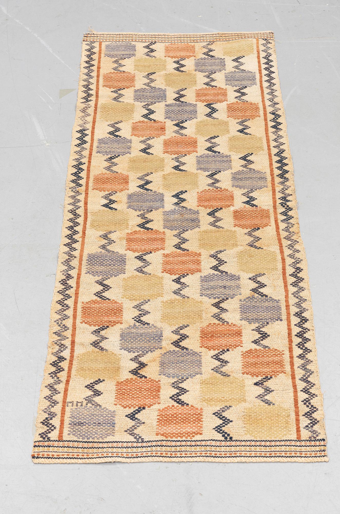 Märta Måås-Fjetterström, A textile, "Skaftblomman", flat weave, ca 131,5 x 47 cm, signed MMF.