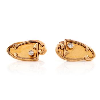 A pair of 14K gold cufflinks set with old-cut diamonds.