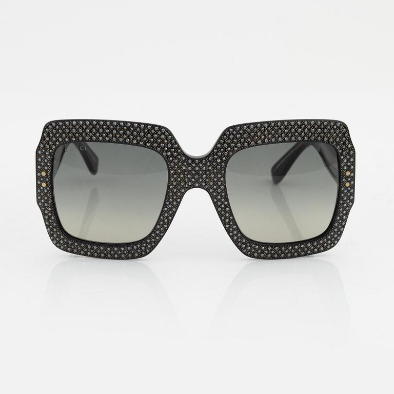 Gucci, a pair of black plastic and rhinestone sunglasses.