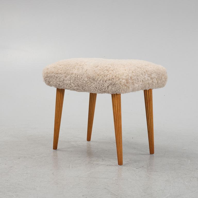 A sheepskin upholstered stool, mid 20th Century.