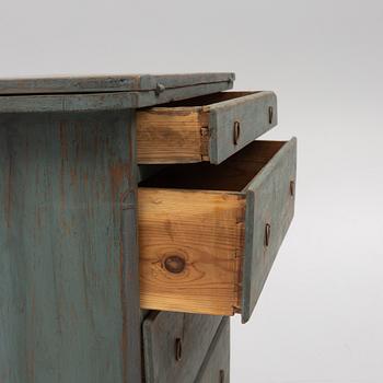 A combined chest of drawers and table, 19th century.