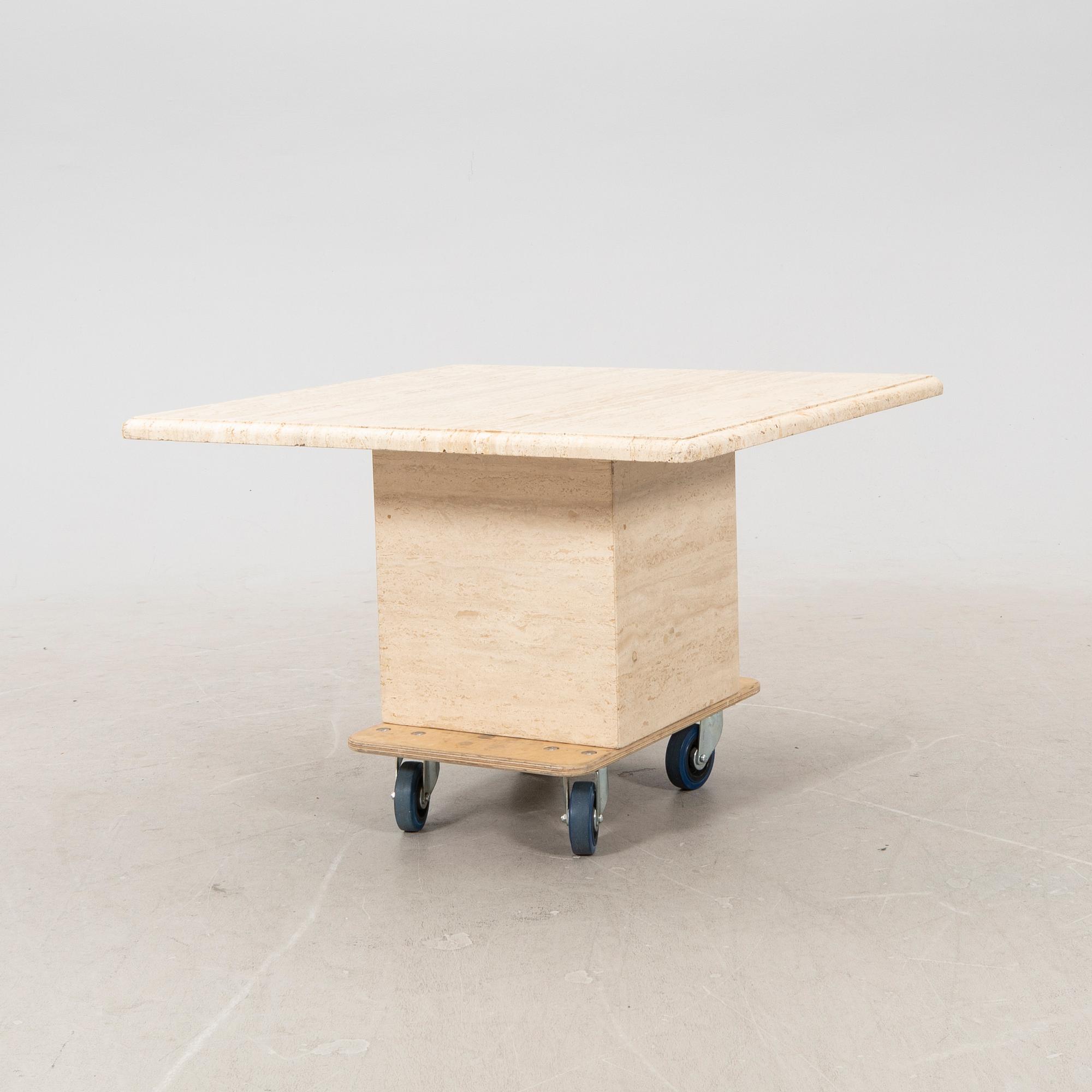 A late 20th century travertin coffee table.