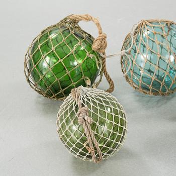 Seven glass floats, 20th century.