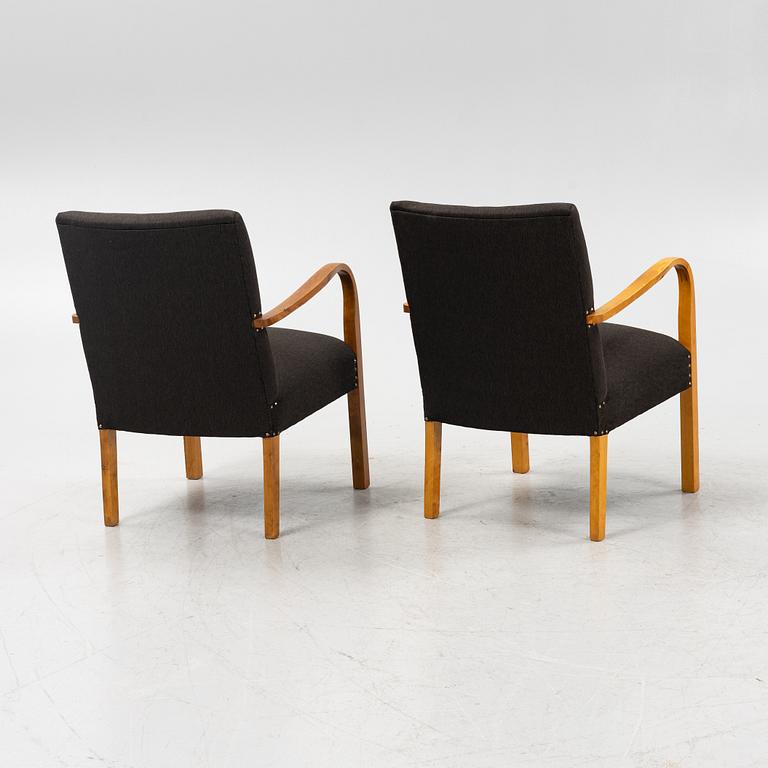 A pair of 1930's/40's armchairs.