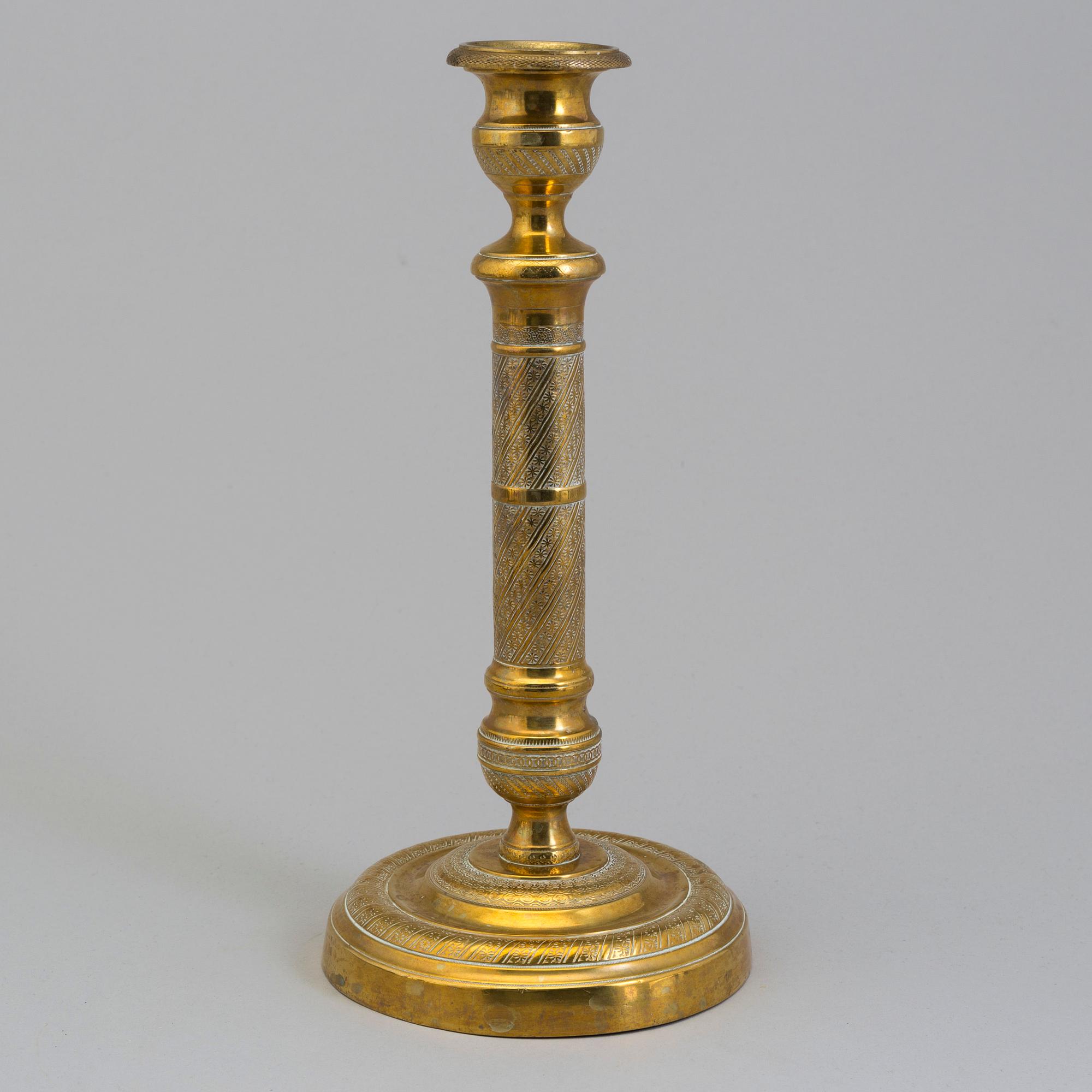 AN EMPIRE ORMOLU CANDLESTICK, first half of the 19th century.