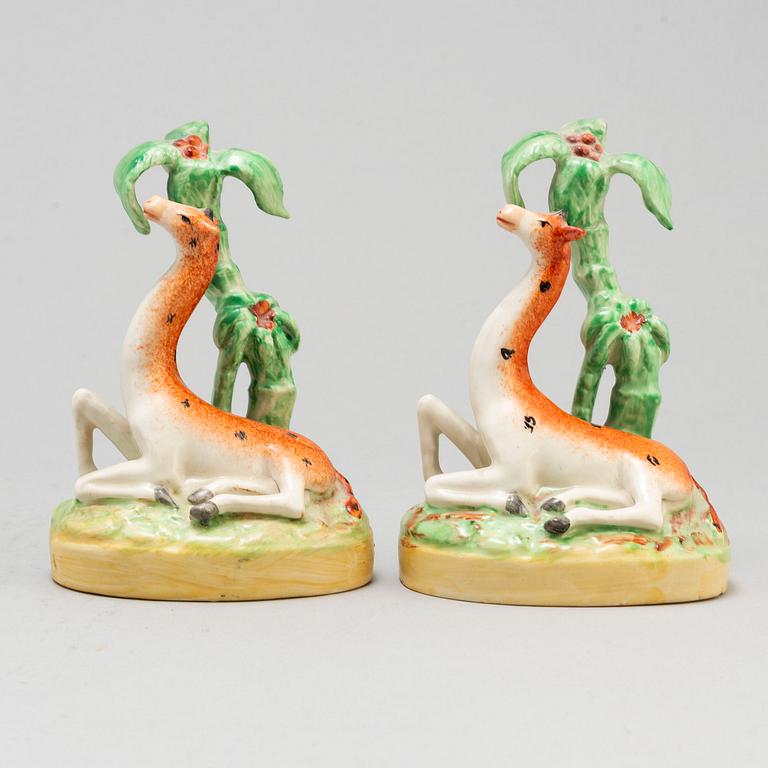 A pair of ceramic figures of giraffes, England, presumably Staffordshire, 19th century.