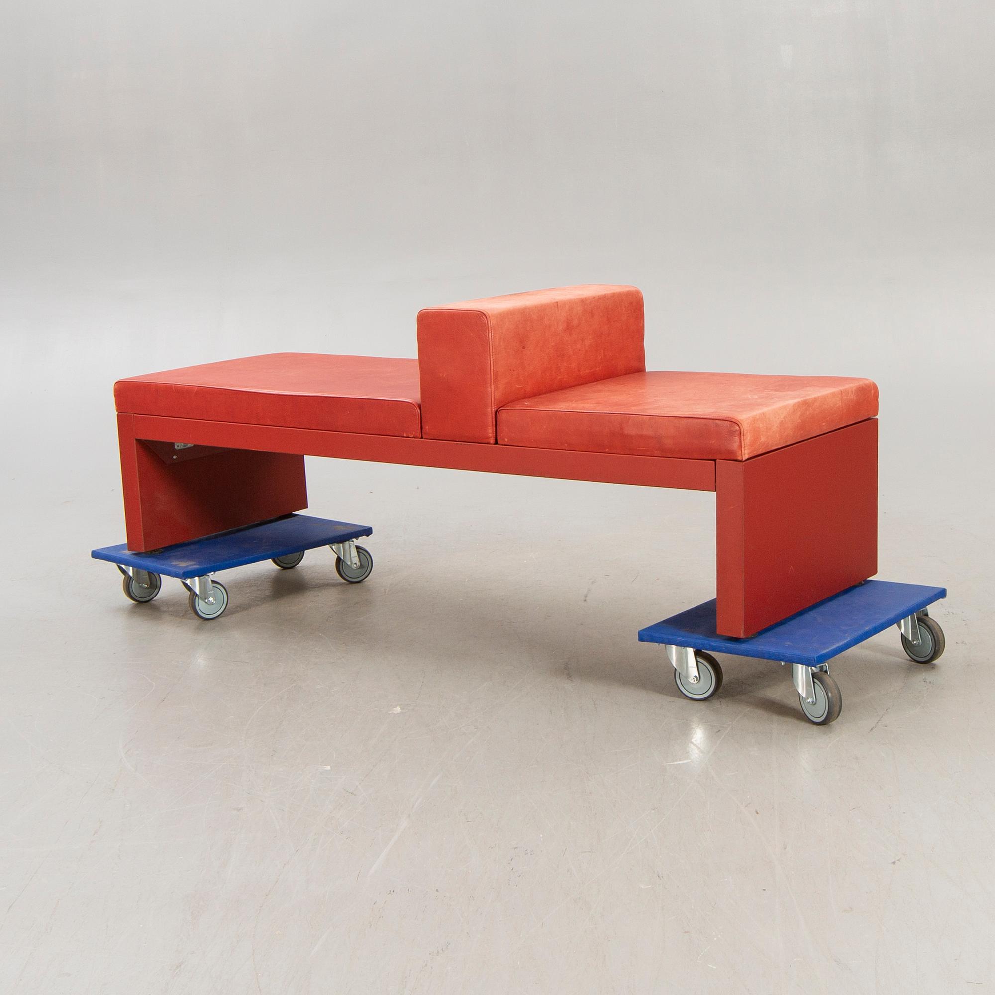 An Italian leather bench later part of the 20th century.