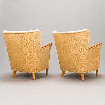 A pair of 1950's armchairs.