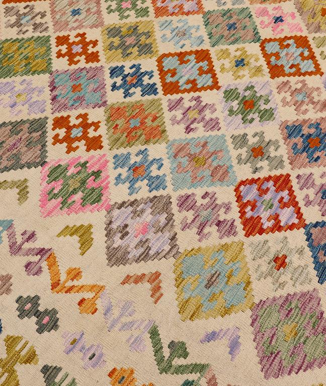 A Kilim rug, approx. 295 x 243 cm.