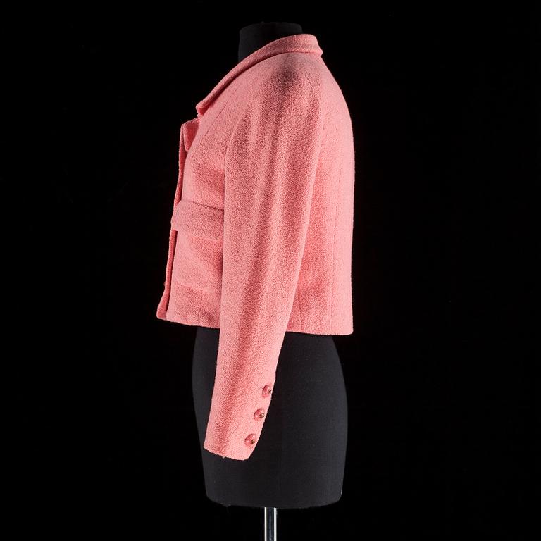 A pink bouclé jacket by Chanel.