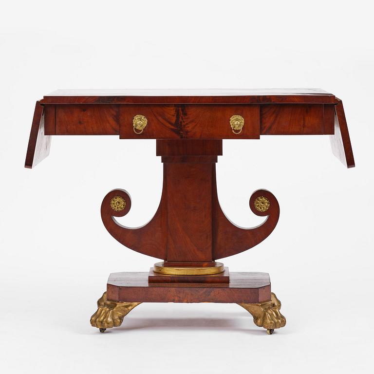 A Swedish Empire mahogany center table.