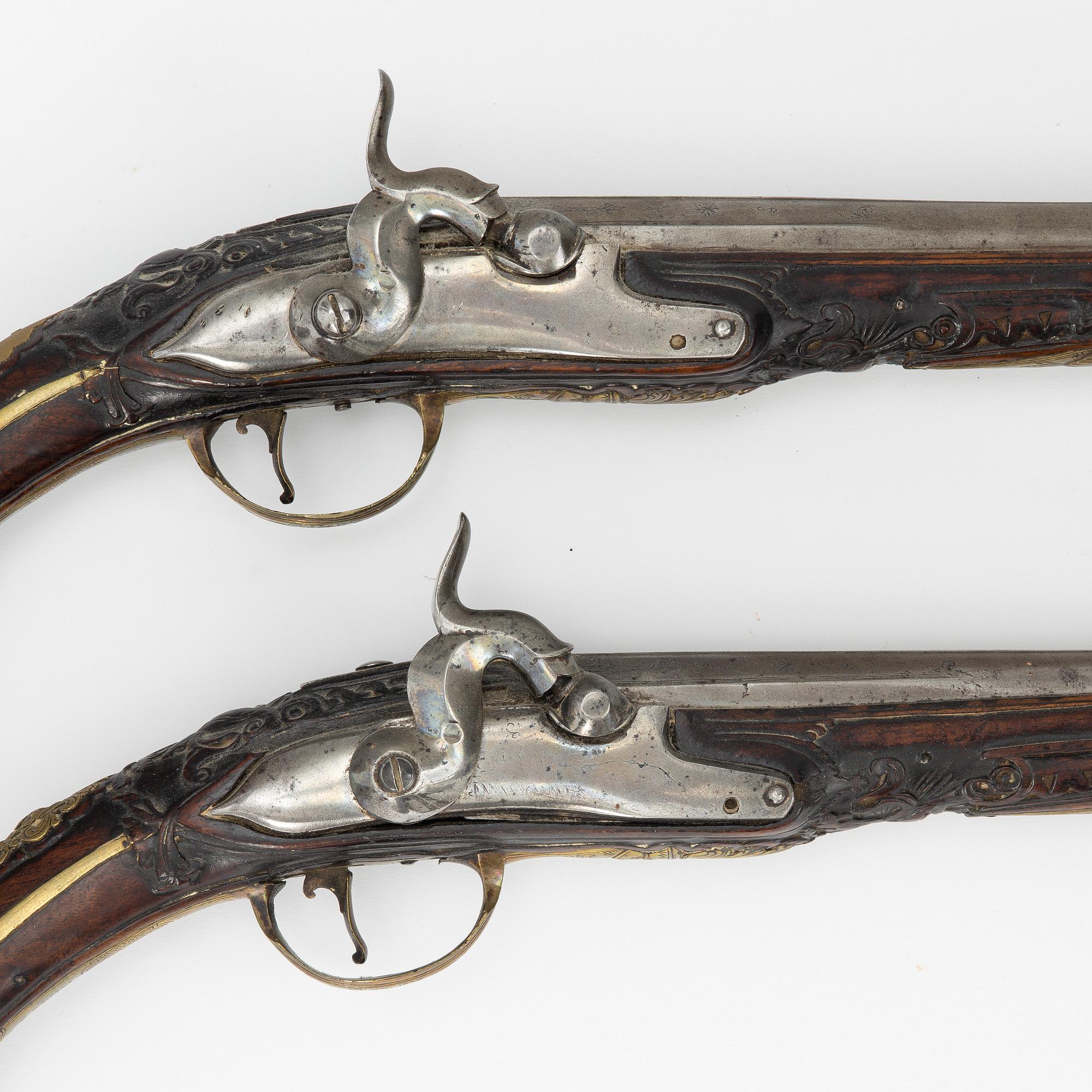 A pair of percussion pistols, converted from flintlock. 18th century.