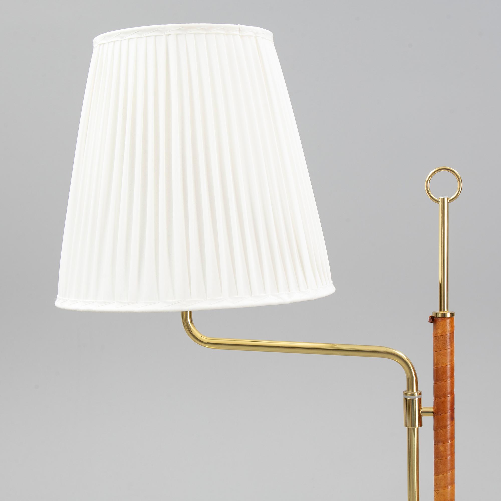 A pair of brass and leather floor lights, Örsjö Industri, 21st century.