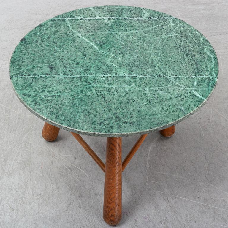 A late 20th century stone and wood coffee table.