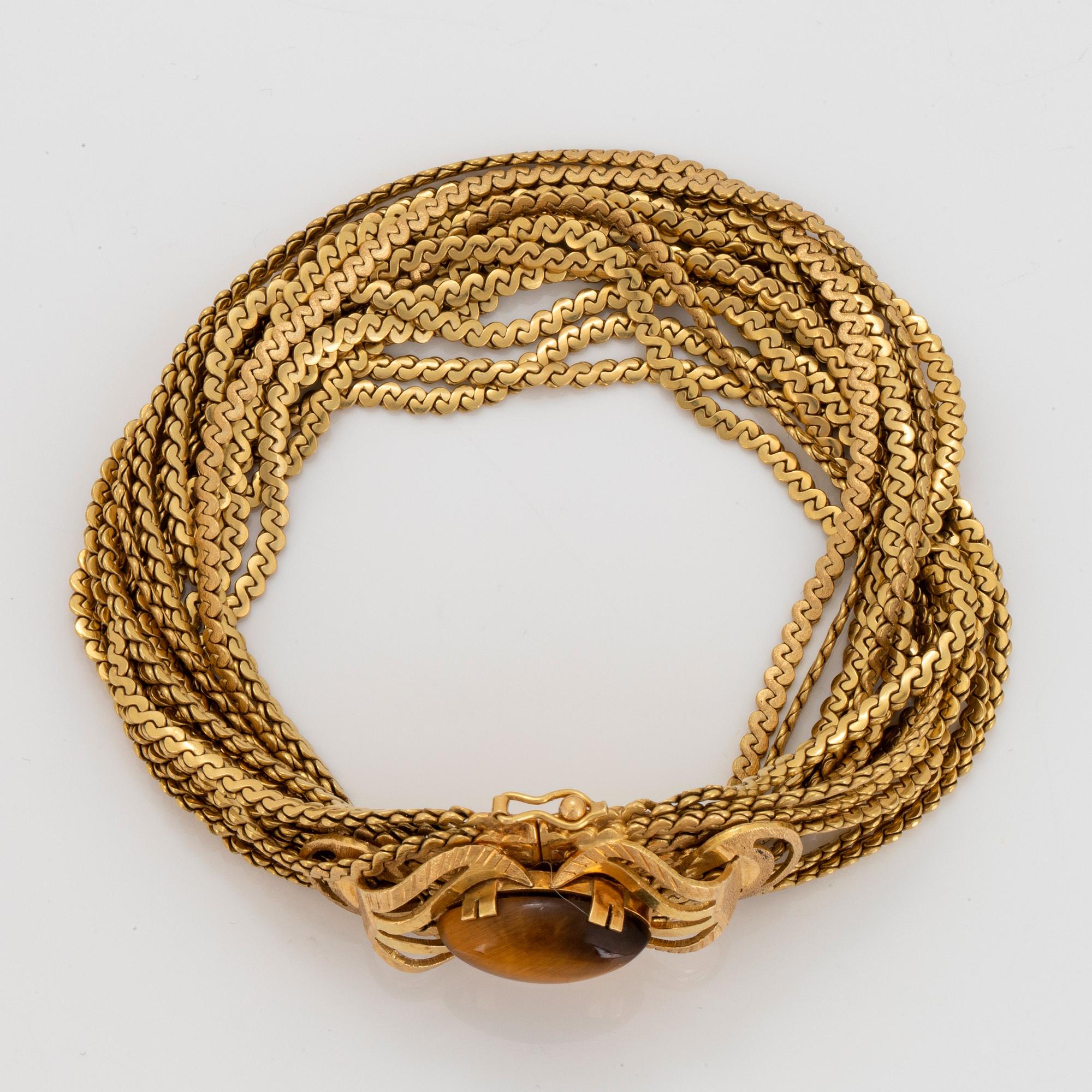 Armband 18K guld med kvarts-kattöga.