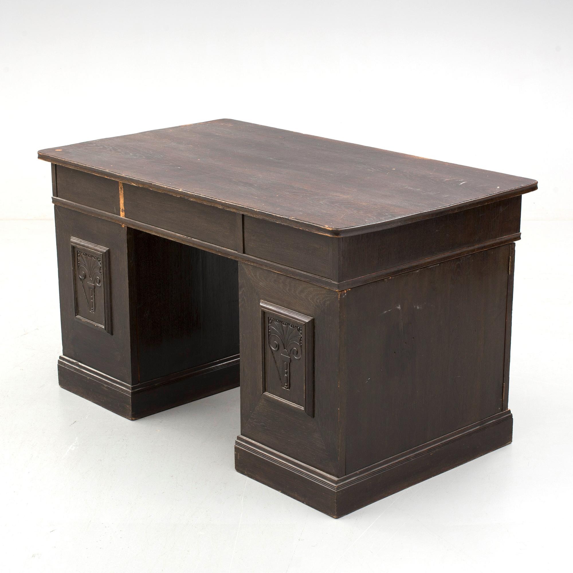 An early 1900s oak writing desk.