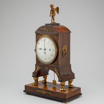 A Biedermeier pendulum clock, Vienna, first half of the 19th century.