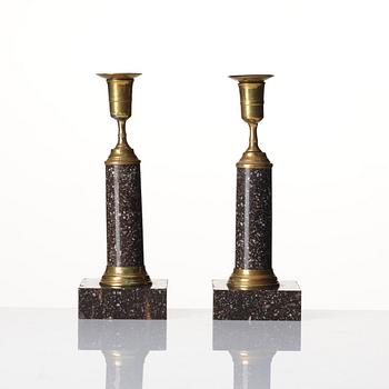 A pair of late Gustavian gilt-brass and 'Blyberg' porphyry candlesticks, Stockholm, circa 1800.