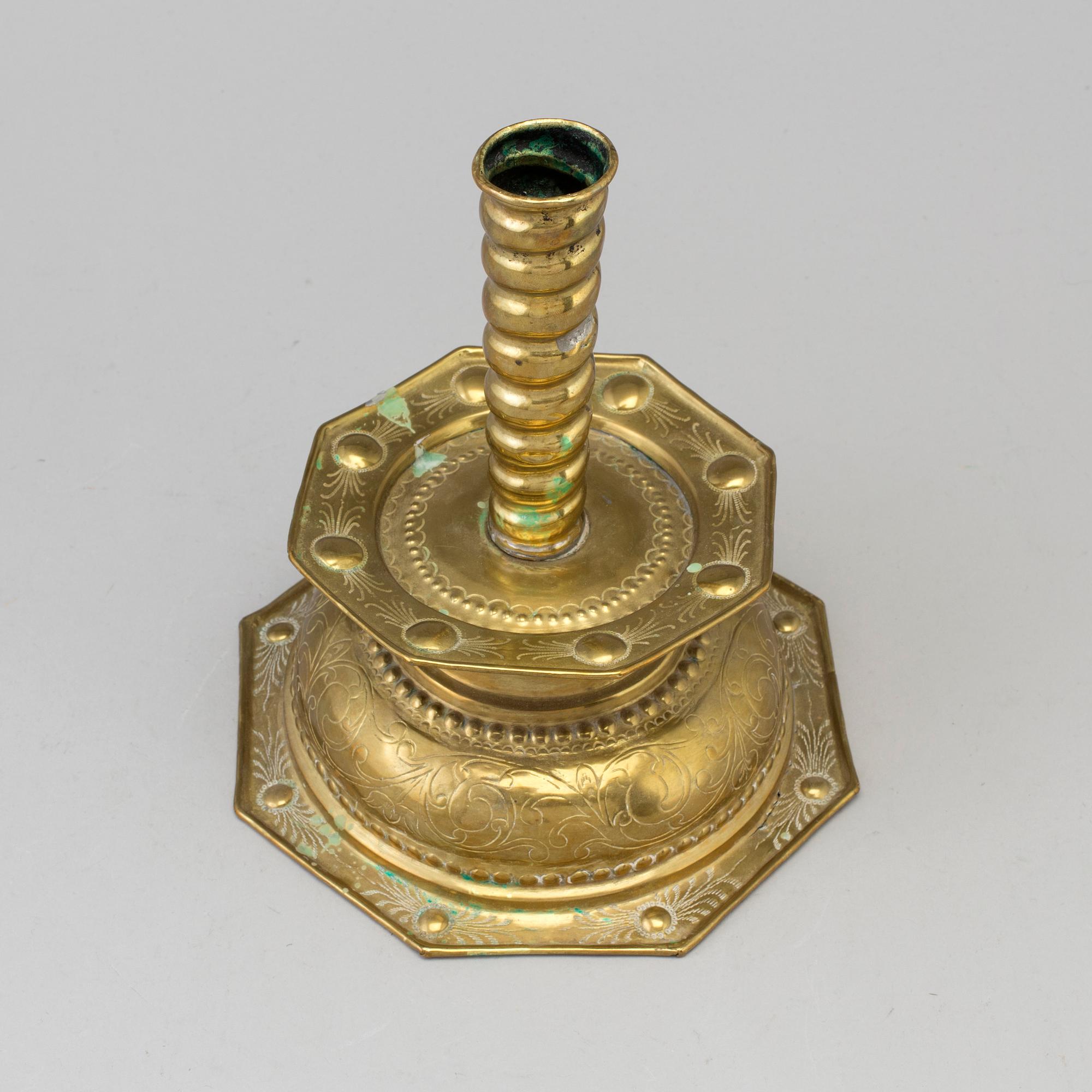 A 18th century Baroque brass candlestick.