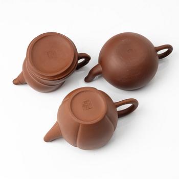 A group of three yixing 'gongfu' teapots, China, 1980s.
