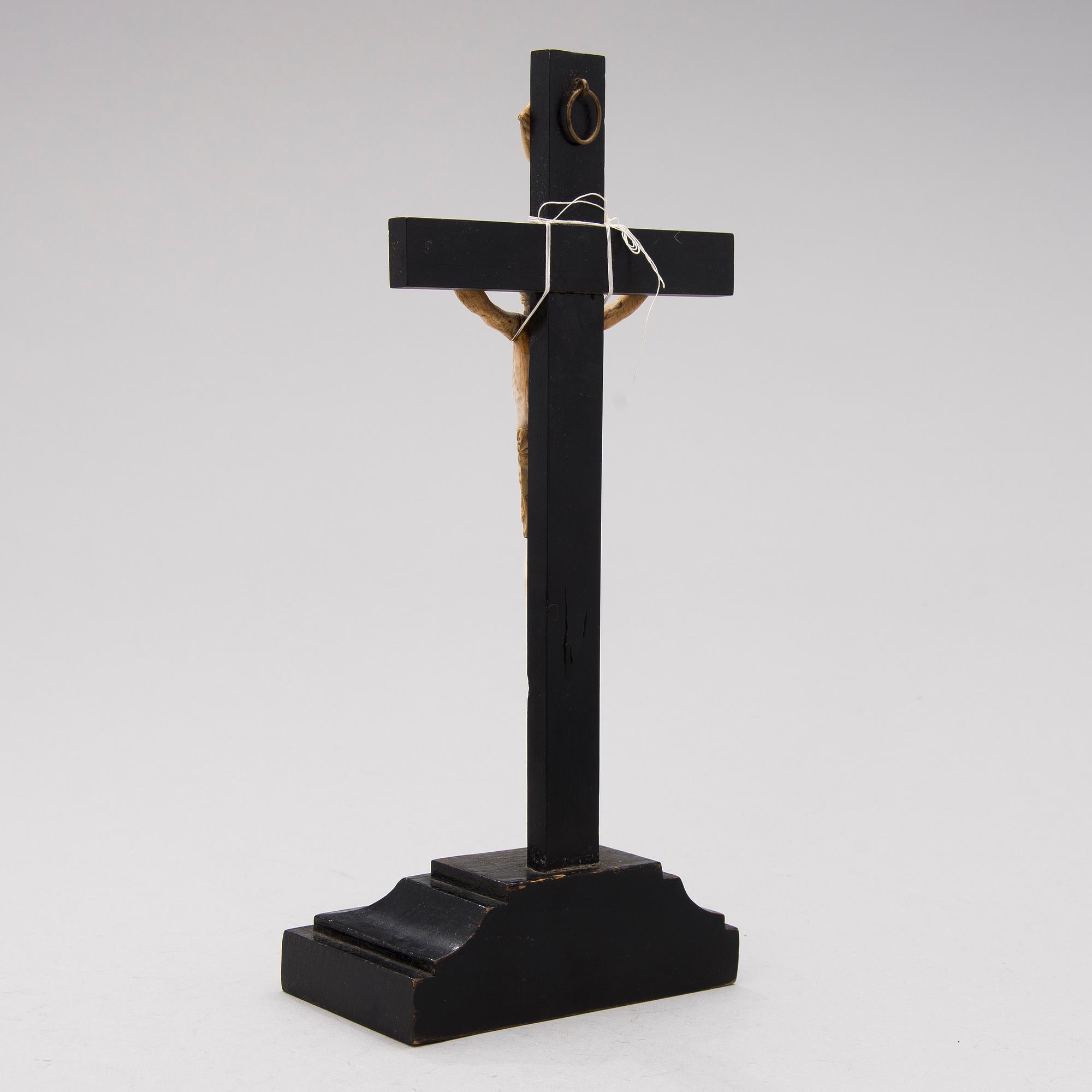 A WOODEN AND BONE TABLE CRUCIFIX with base. 19th Century.