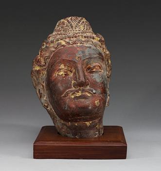 A grey schist head of a Bodhisattva, Ghandara, presumably circa AD 3rd Century.