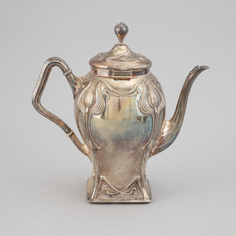 An art nouveau silver coffee pot, sugar bowl and creamer, mark of CF Källström, Malmö 1901.