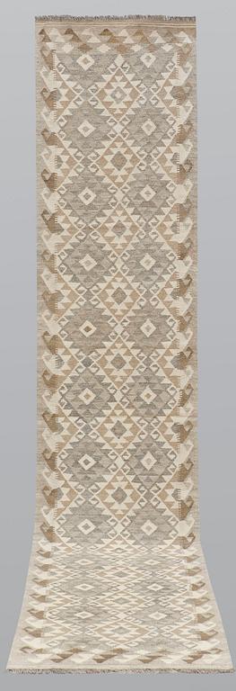 A runner, kilim, ca 387 x 79 cm.